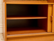Load image into Gallery viewer, Close-up of a wooden cabinet or shelf unit with two open shelves and a sliding door on the right, shown against a light wall.