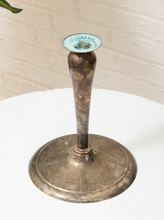 Load image into Gallery viewer, Vintage silver-tone candlestick holder with slender tapered stem, flared candle cup, broad round base, and aged patina