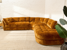 Load image into Gallery viewer, Prima curved sectional sofa in Thriller Amber with golden amber upholstery, deep button-tufted seats, channel-tufted back cushions, and rounded silhouette