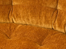 Load image into Gallery viewer, Close-up of a tufted sofa upholstered in textured mustard-yellow fabric.