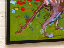 Load image into Gallery viewer, A close-up of a framed painting on a white brick wall, showing a green background with expressive brushstrokes in red, blue, brown, and yellow, along with part of a brown and pink figure.