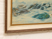 Load image into Gallery viewer, A close-up of a framed painting depicting turbulent blue and white ocean waves, mounted on a white brick wall. The frame has a distressed brown wood finish with a cream mat.
