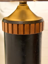 Load image into Gallery viewer, Close-up of a vintage-style table lamp base featuring a glossy black cylindrical body, a warm brown ribbed wooden collar, and a metallic gold top finial.