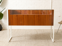 Load image into Gallery viewer, Danish modern wood jewelry display case with clear glass top, multiple shallow drawers, and squared metal frame and legs