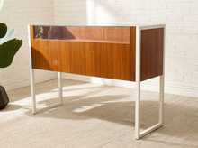 Load image into Gallery viewer, Danish modern wood jewelry display case with clear glass top, multiple shallow drawers, and squared metal frame and legs