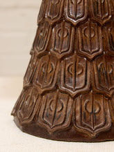 Load image into Gallery viewer, Close-up of a dark brown textured decorative object with an embossed geometric pattern, set against a light beige background.
