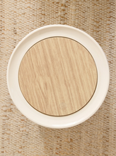 Load image into Gallery viewer, Modern white cylindrical trash can with round wood-look lid and three tapered wood-tone legs
