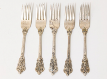 Load image into Gallery viewer, Five ornate silver forks with decorative filigree handles, arranged in a row against a plain white background.