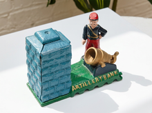Load image into Gallery viewer, A decorative miniature artillery bank figurine featuring a blue brick tower, a soldier figure, a cannon, and a green base labeled 'ARTILLERY BANK' on a white surface.