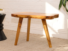 Load image into Gallery viewer, Vintage live edge wood side table with irregular natural wood tabletop, honey-brown grain, visible knots, and three tapered wooden legs