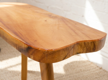 Load image into Gallery viewer, Vintage live edge wood side table with irregular natural wood tabletop, honey-brown grain, visible knots, and three tapered wooden legs