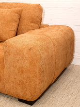 Load image into Gallery viewer, Felipe modern lounge chair in warm terracotta textured upholstery with deep channel-tufted seat, oversized padded arms, rounded silhouette, and coordinating cushions