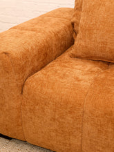 Load image into Gallery viewer, Felipe modern lounge chair in warm terracotta textured upholstery with deep channel-tufted seat, oversized padded arms, rounded silhouette, and coordinating cushions