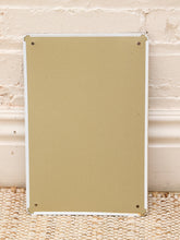 Load image into Gallery viewer, A blank, unbranded beige rectangular board or sign with rounded corners and four metal mounting holes, shown against a white brick wall and woven rug.