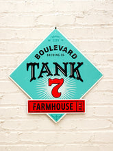 Load image into Gallery viewer, Diamond-shaped Boulevard Brewing Co. Tank 7 Farmhouse Ale metal advertising sign with turquoise-green background, large black Tank lettering, red number seven, cream sunburst graphics, and red Farmhouse banner