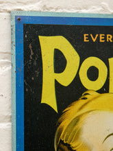 Load image into Gallery viewer, Vintage-style Popsicle advertising sign with black background, large yellow Popsicle lettering, smiling cartoon boy holding a yellow frozen treat, blue bow tie, and blue border
