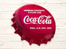 Load image into Gallery viewer, Vintage Coca-Cola advertising metal sign shaped like an oversized red bottle cap with scalloped edges, white Coca-Cola script, and Minimum Contents 6 Fluid Ozs lettering