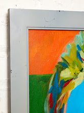 Load image into Gallery viewer, A close-up of an abstract canvas painting in a distressed gray frame, showing a vibrant orange and green background with blue, yellow, and red brushstrokes.