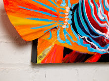 Load image into Gallery viewer, Contemporary tropical fish painting by Jean Bradley featuring a vibrant orange, turquoise, and coral fish with intricate swirling patterns, prominent eye, and fins extending beyond the dark navy canvas.