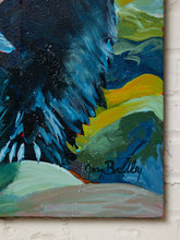 Load image into Gallery viewer, Image 7 of 8: An abstract landscape painting on canvas featuring a dark blue raven in sharp detail against green, yellow, and blue hills, signed 'Sean Buddly' near the bottom center, displayed on a white brick wall.