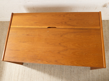 Load image into Gallery viewer, Image 7 of 22: Mid-century modern wooden storage cabinet with a warm honey finish and visible wood grain, shown from a top-down angle on a textured beige rug.