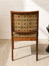 Load image into Gallery viewer, Image 5 of 15: Vintage wooden side chair featuring a square sage green upholstered backrest, cushioned floral tapestry seat with diamond lattice patterns in burgundy, blue, olive, and golden beige, and slender tapered wooden legs.