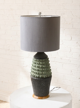 Load image into Gallery viewer, Image 3 of 17: Vintage table lamp with light gray drum shade and textured sage green and charcoal brown sculptural base