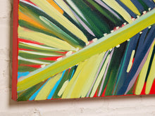 Load image into Gallery viewer, Image 5 of 8: Abstract canvas wall art featuring bold painted leaf-like strokes in green, yellow, blue, red, orange, and white, shown hanging against a white brick wall.