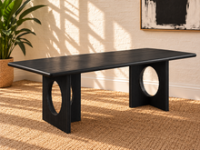 Load image into Gallery viewer, Sylvia dining table in Charcoal with rectangular rounded-edge top and sculptural black fluted pedestal bases with circular cutouts.