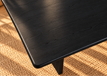 Load image into Gallery viewer, Sylvia dining table in Charcoal with rectangular rounded-edge top and sculptural black fluted pedestal bases with circular cutouts.