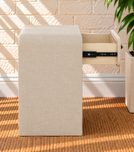 Load image into Gallery viewer, Thiago Greige linen-textured nightstand with rounded frame, drawer, matte black wave handle, and open lower shelf.