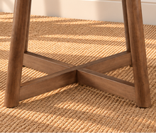Load image into Gallery viewer, Image 4 of 4: Tori 47-inch round dining table in Natural Walnut with sculptural cross base and rounded tabletop edge