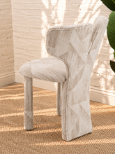 Load image into Gallery viewer, Vada cream beige patterned dining chair with sculptural split back, rounded upholstered seat, and fully upholstered legs.
