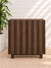 Load image into Gallery viewer, Veda dark oak bar cabinet with vertical striped oak and walnut veneer doors and raised wood base