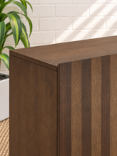 Load image into Gallery viewer, Veda dark oak bar cabinet with vertical striped oak and walnut veneer doors and raised wood base