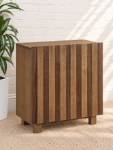 Load image into Gallery viewer, Veda warm oak bar cabinet with alternating vertical oak and walnut veneer striped doors and raised wood legs