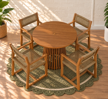 Load image into Gallery viewer, Victoria warm teak outdoor dining set with round slatted pedestal table and four woven faux rattan armchairs
