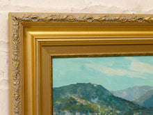 Load image into Gallery viewer, Original Felice Hrovat landscape painting with rolling green hills, mature trees and deep blue mountains in an ornate gold-tone frame.