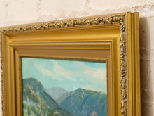 Load image into Gallery viewer, Original Felice Hrovat landscape painting with rolling green hills, mature trees and deep blue mountains in an ornate gold-tone frame.