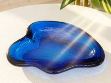 Load image into Gallery viewer, Vintage cobalt blue sculptural art glass ashtray with thick curved edges and organic hand-formed shape.