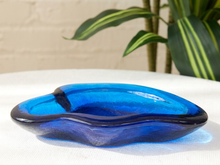 Load image into Gallery viewer, Vintage cobalt blue sculptural art glass ashtray with thick curved edges and organic hand-formed shape.