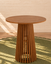 Load image into Gallery viewer, Vivian 31-inch round bar table in warm teak with slatted tabletop and tall sculptural vertical slat pedestal base