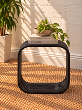 Load image into Gallery viewer, Walter side table in Midnight Cafe Mindi wood with a rounded rectangular top, curved arch-style sides, and visible natural wood grain.