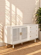 Load image into Gallery viewer, Image 3 of 4: Yvette TV stand in Chalk White with three drawers, two-door storage cabinet, gold details, and elevated legs