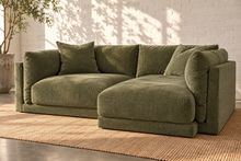 Load image into Gallery viewer, Image 2 of 4: Hansel two-piece modular sectional sofa in Amici Moss, right-facing configuration shown from a front three-quarter angle with plush velvet texture