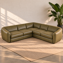 Load image into Gallery viewer, Image 3 of 8: Lucero olive-toned leather corner sectional with two equal sofa sections, a square corner seat and rounded arms, styled on a plain beige rug.