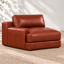 Load image into Gallery viewer, Image 4 of 5: Simulated Montara left-arm chair in Brighton Hero brown leather, showing the lower padded armrest and taller rear section in Sunbeam’s white brick setting.