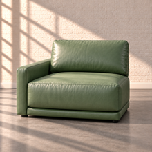 Load image into Gallery viewer, Image 15 of 18: Simulated Orinda individual left-arm chair module in sage green Sequoia Rainforest leather, without accent pillows, in the Sunbeam white brick setting.