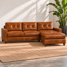 Load image into Gallery viewer, Image 1 of 13: Solano 103-inch two-piece sectional in distressed Sequoia Fawn caramel leather, with tufted backs and a chaise on the viewer’s right.