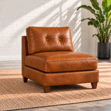 Load image into Gallery viewer, Image 12 of 13: Solano armless leather chair in distressed Sequoia Fawn, with a button-tufted back and tapered walnut legs.